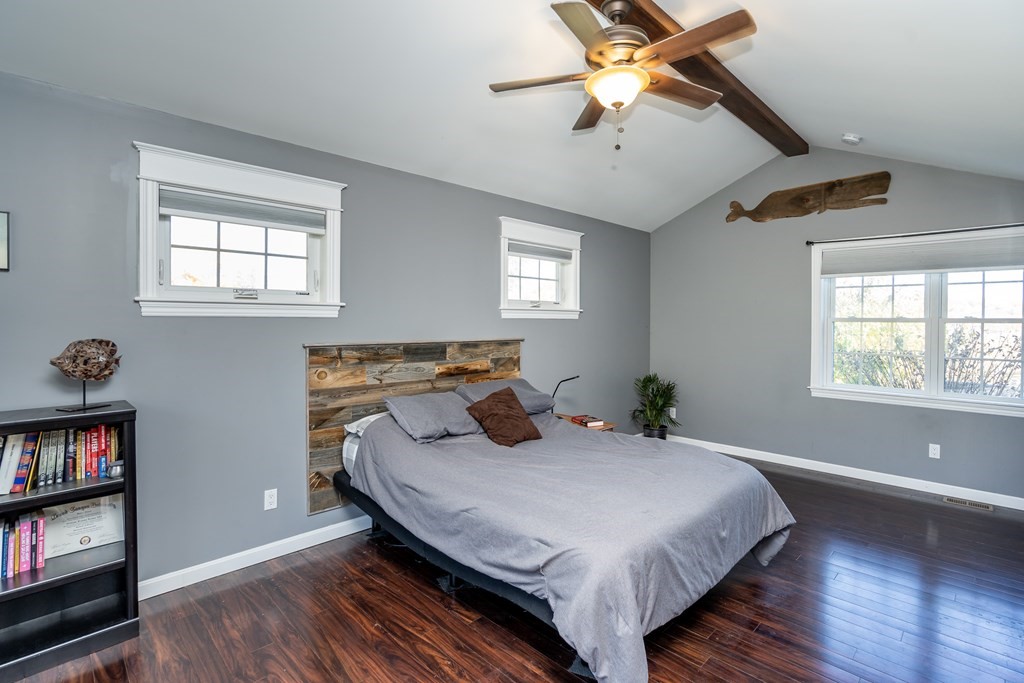 120 Stebbins Road Monson, MA 01057 - Photo 36 of 41 a bedroom with a bed and a bookshelf with wooden floor