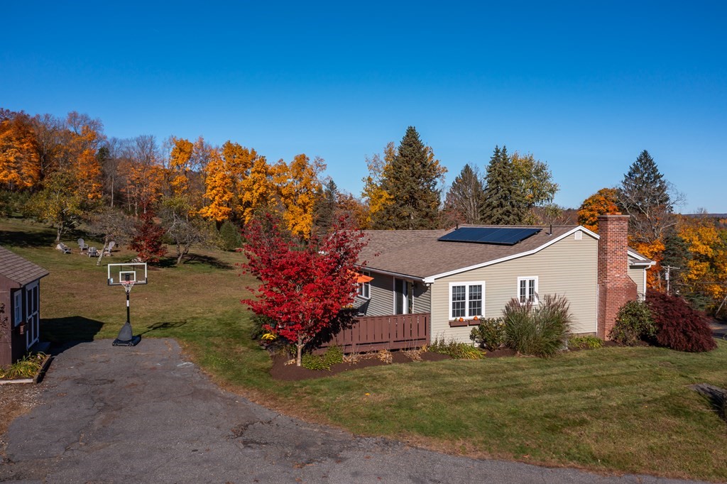 120 Stebbins Road Monson, MA 01057 - Photo 5 of 41 a front view of a house with a yard