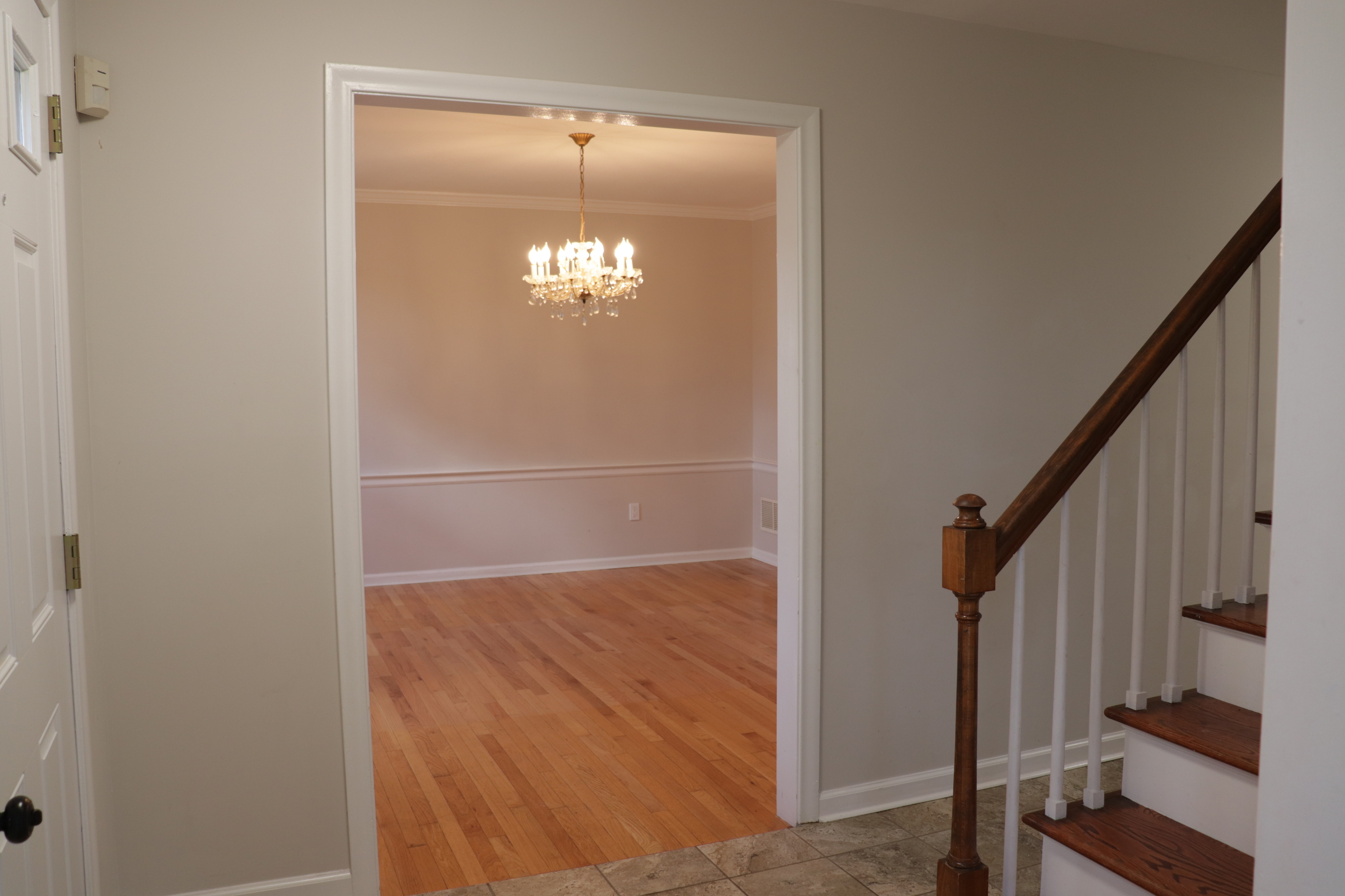 Undisclosed Address Woodbury, CT 06798 - Photo 14 of 27 a view of a livingroom with wooden floor and staircase