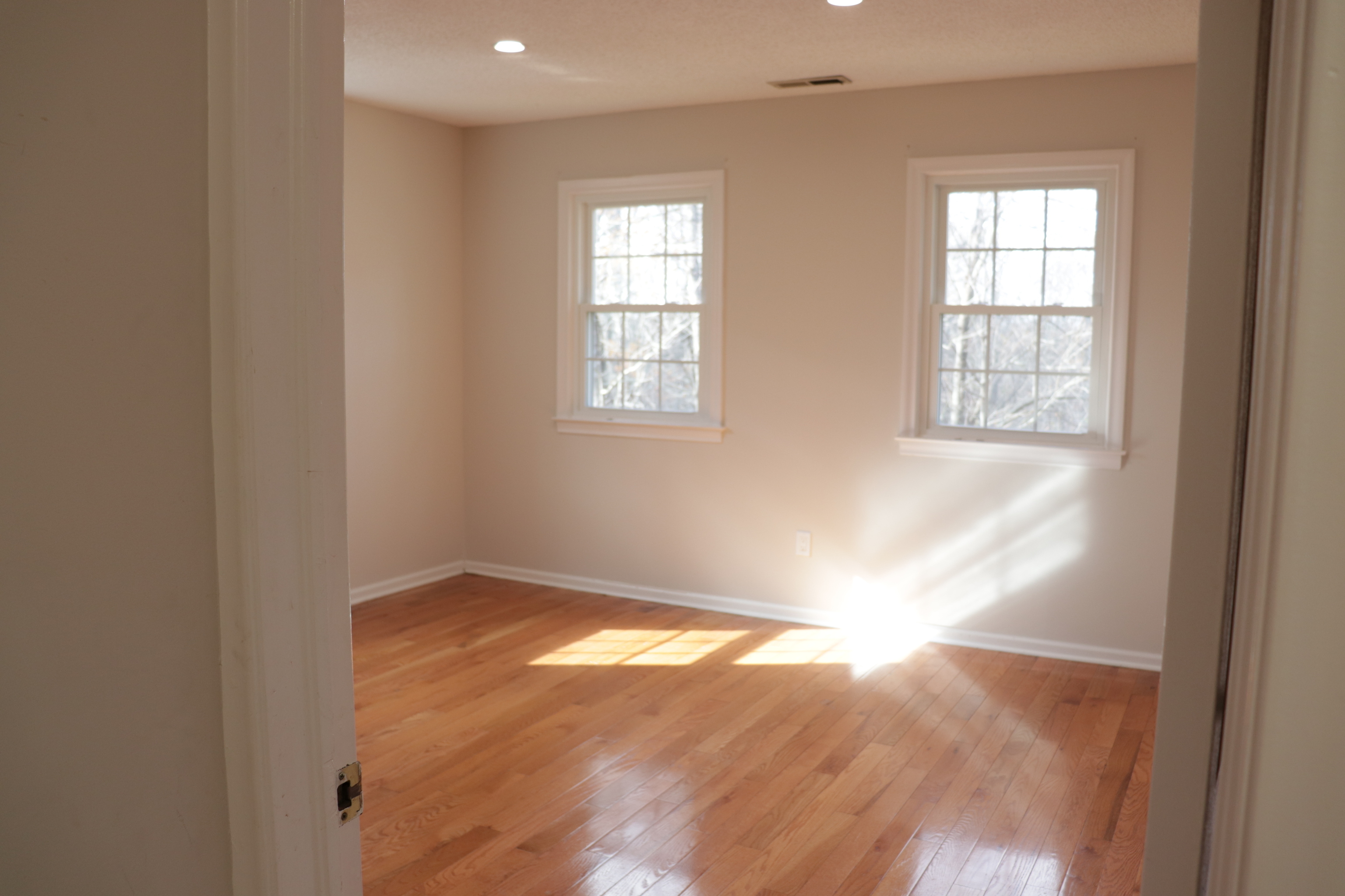 Undisclosed Address Woodbury, CT 06798 - Photo 15 of 27 an empty room with wooden floor and windows