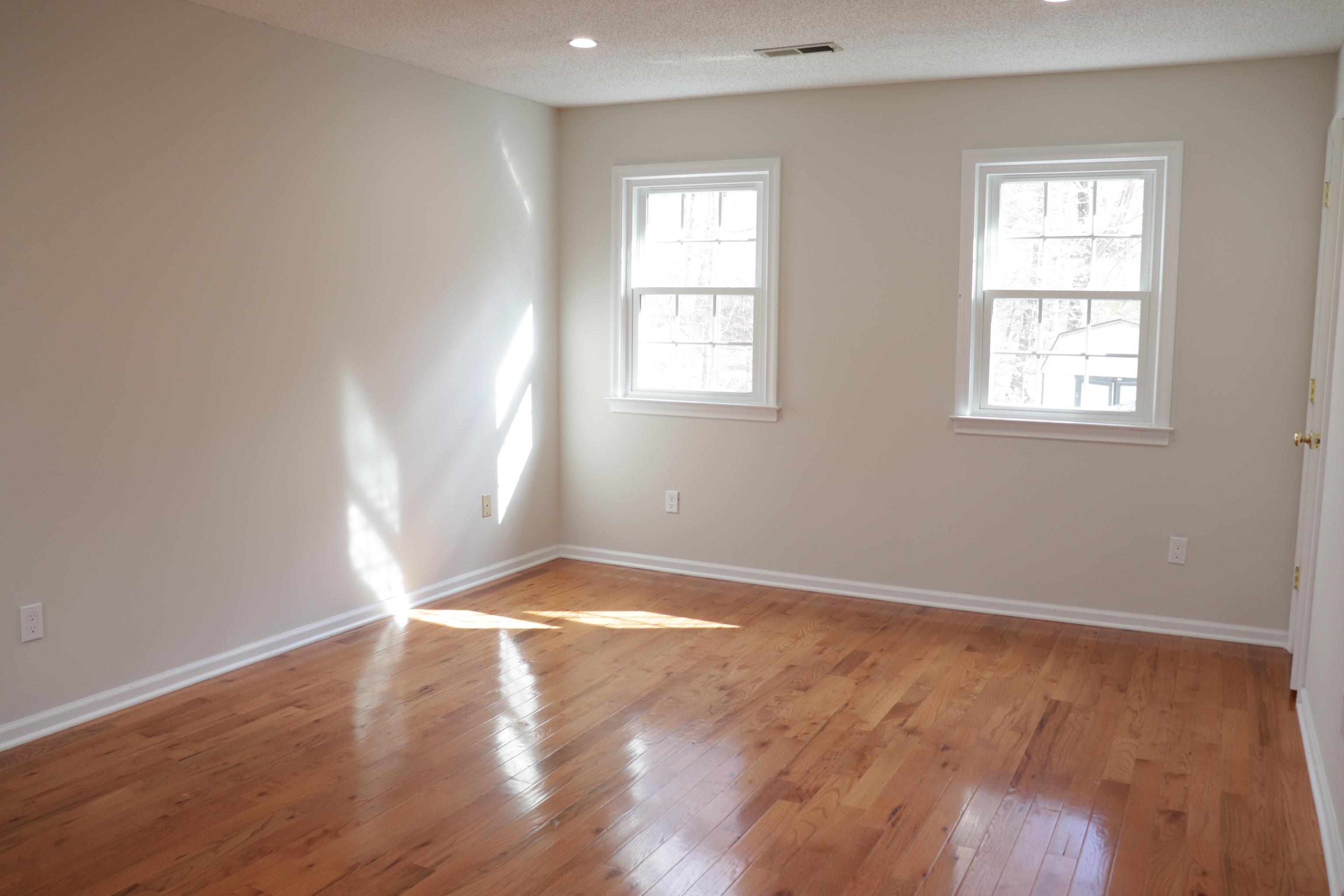 Undisclosed Address Woodbury, CT 06798 - Photo 21 of 27 an empty room with wooden floor and windows