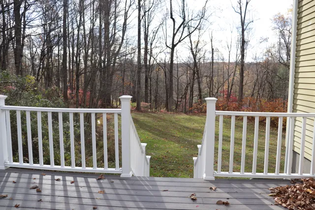 a view of a wooden deck and lake