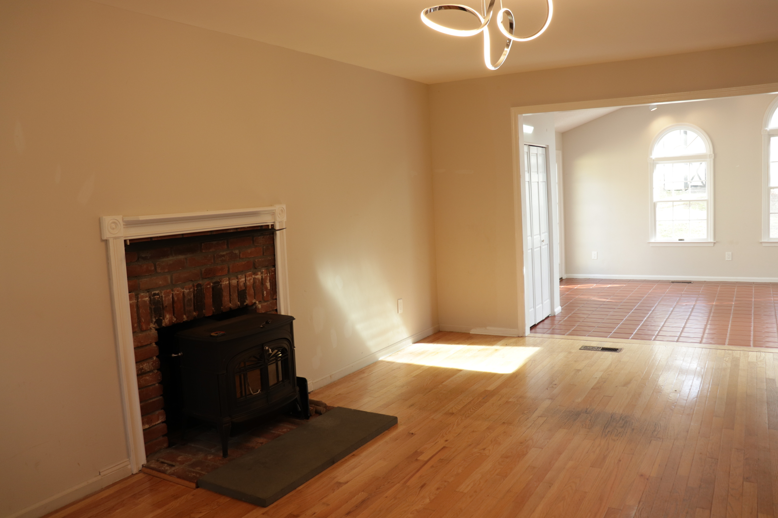 Undisclosed Address Woodbury, CT 06798 - Photo 3 of 27 a view of an empty room with wooden floor and a window