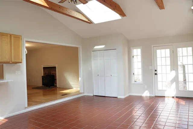 a view of a big room with windows and closet