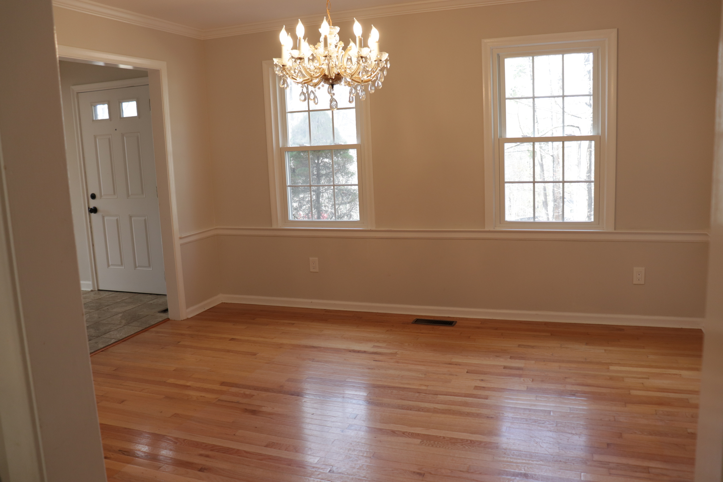 Undisclosed Address Woodbury, CT 06798 - Photo 9 of 27 an empty room with wooden floor and windows