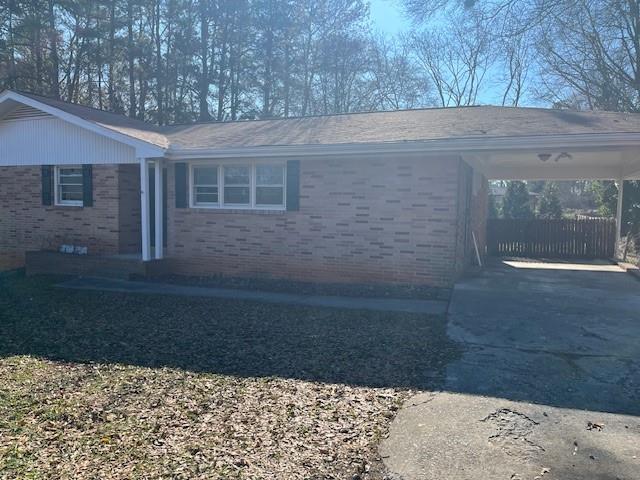 View of front of house featuring a carport