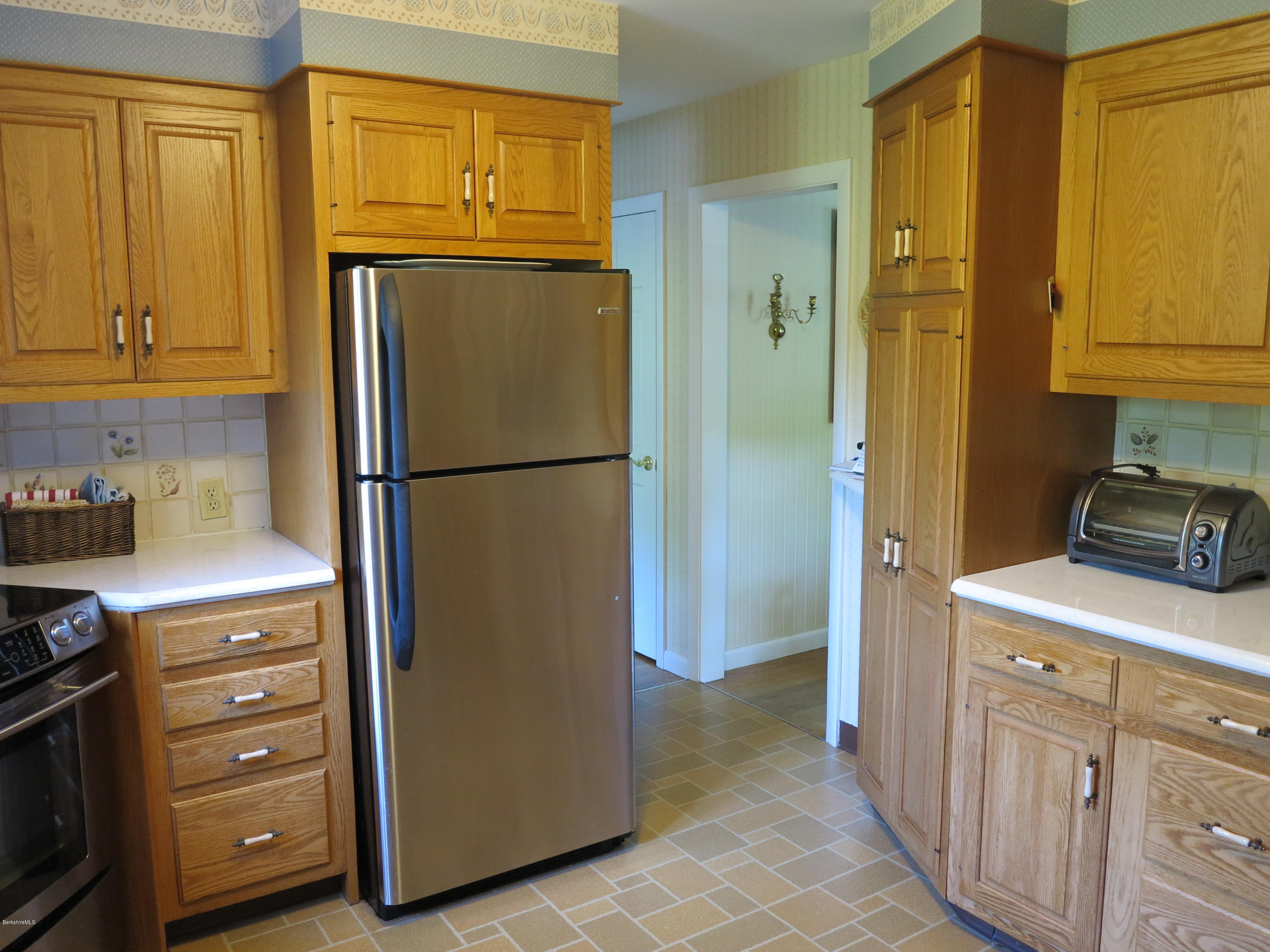 3 Quiet Knoll Road Stockbridge, MA 01266 - Photo 2 of 17 a kitchen with sink refrigerator and cabinets