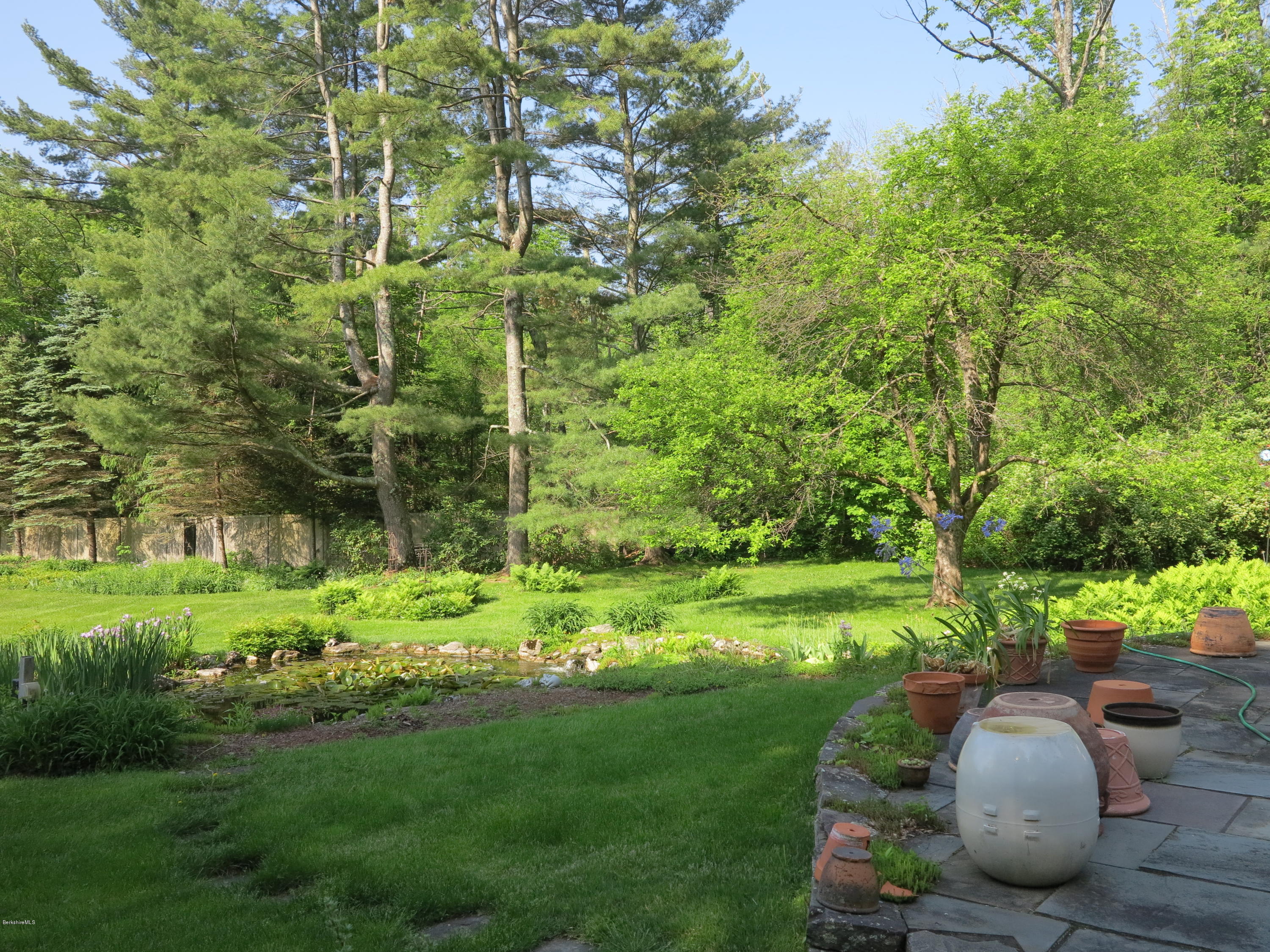 3 Quiet Knoll Road Stockbridge, MA 01266 - Photo 15 of 17 a view of a backyard with large trees
