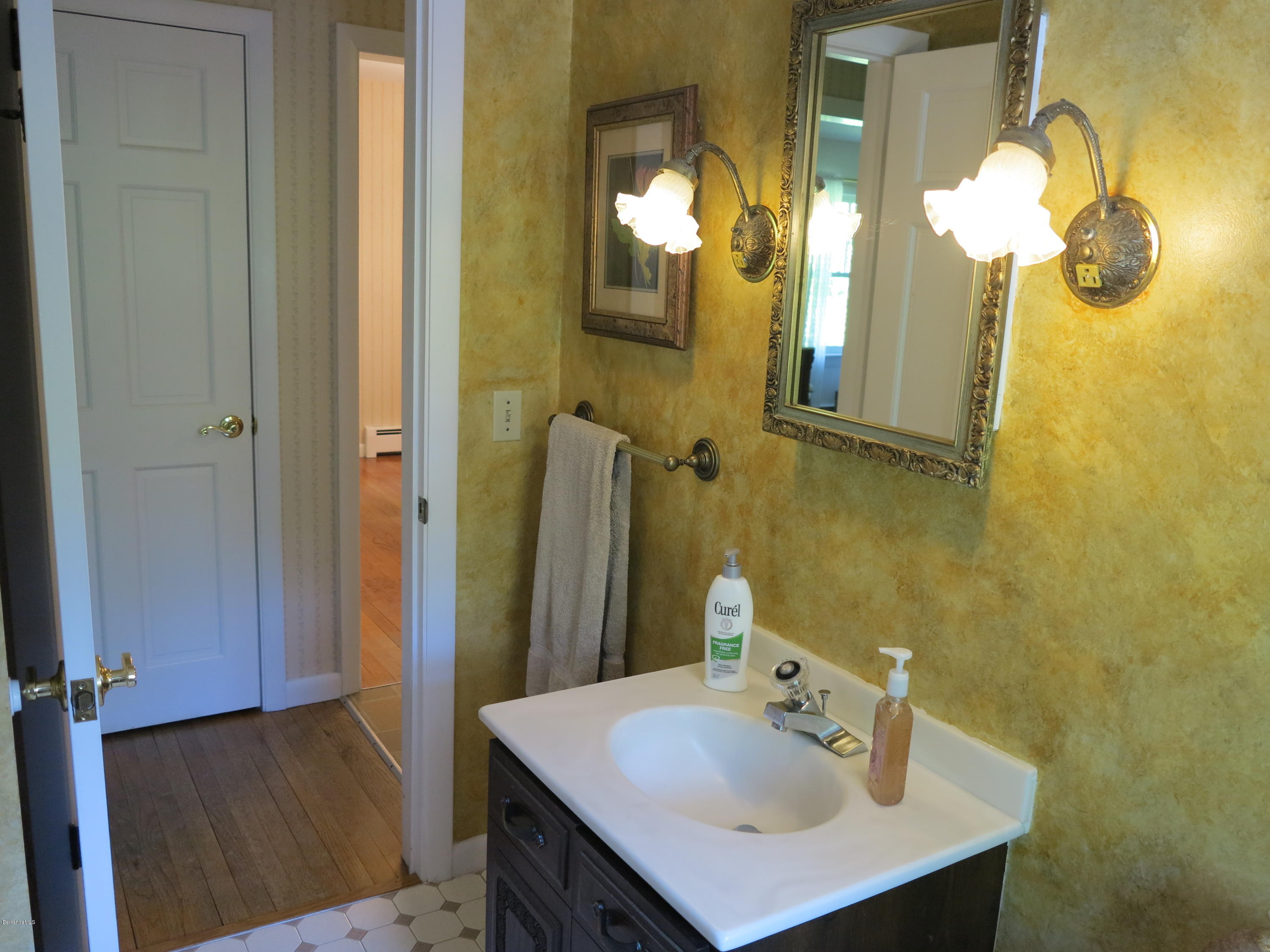 3 Quiet Knoll Road Stockbridge, MA 01266 - Photo 6 of 17 a bathroom with a sink a mirror and a vanity
