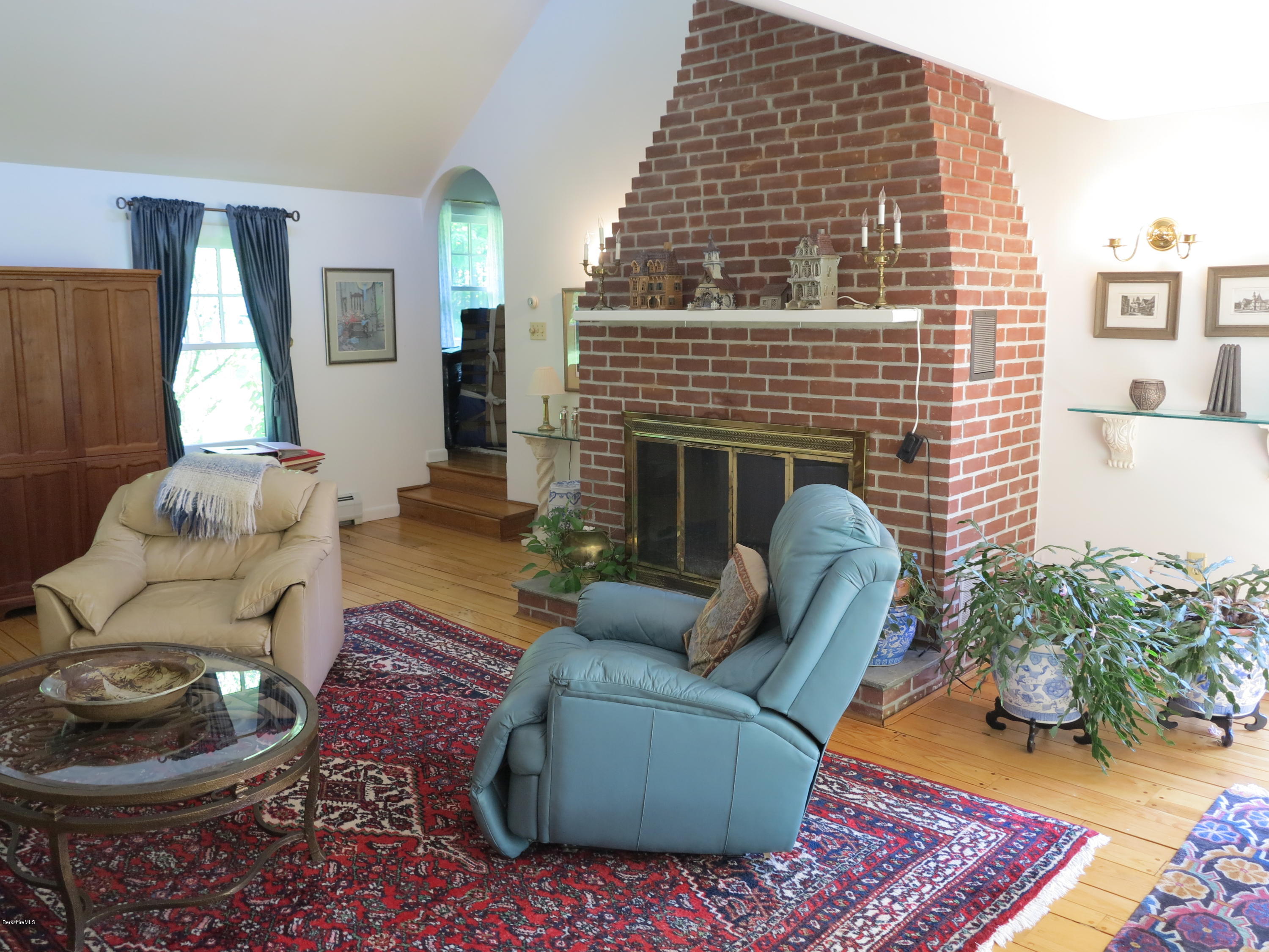 3 Quiet Knoll Road Stockbridge, MA 01266 - Photo 8 of 17 a living room with furniture and a fireplace