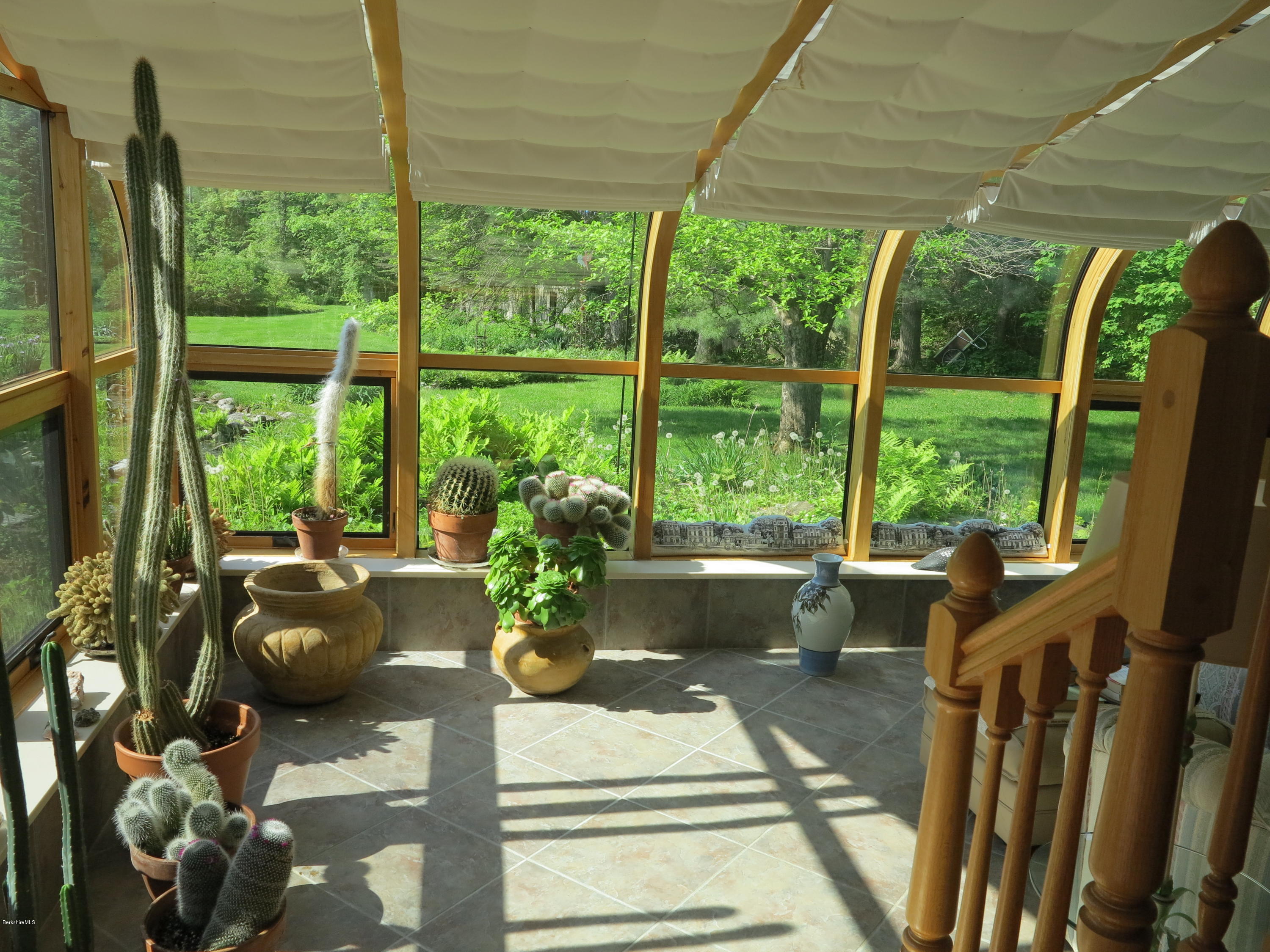 3 Quiet Knoll Road Stockbridge, MA 01266 - Photo 9 of 17 a living room with large windows and furniture