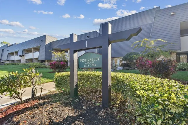 a view of a house with a yard and plants