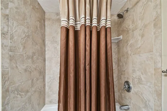 a view of a city from a dining room with furniture and window