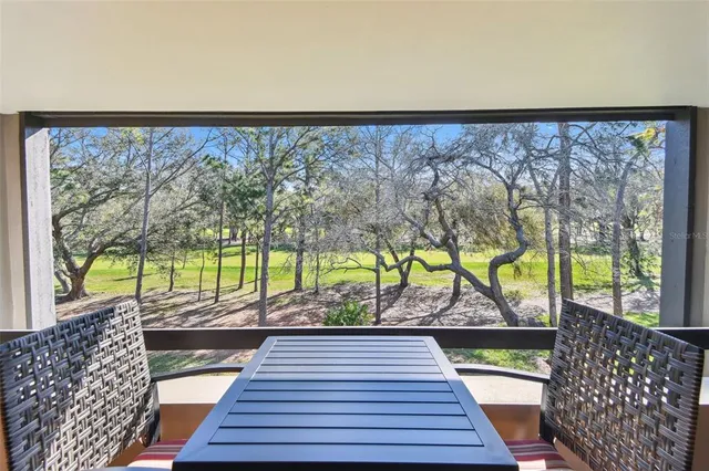 swimming pool view with a seating space