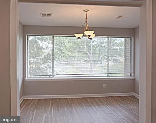 a view of a kitchen from the hallway
