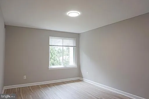a view of wooden floor in an empty room