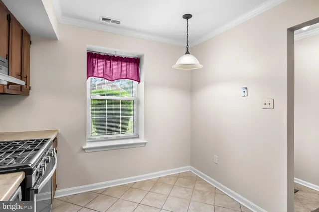 a view of an empty room with closet area