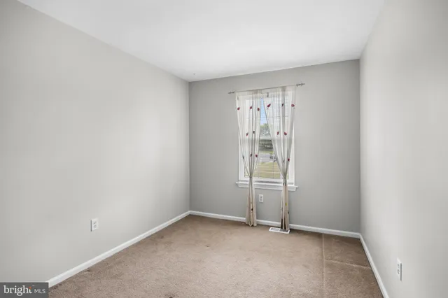 a view of a house with a yard and a deck