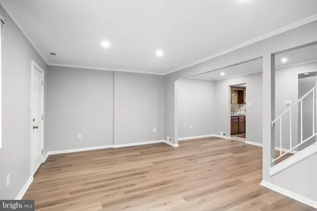 a kitchen with stainless steel appliances granite countertop a stove and a sink
