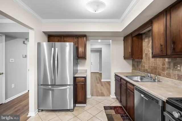 a view of a kitchen with a stove cabinets and a window