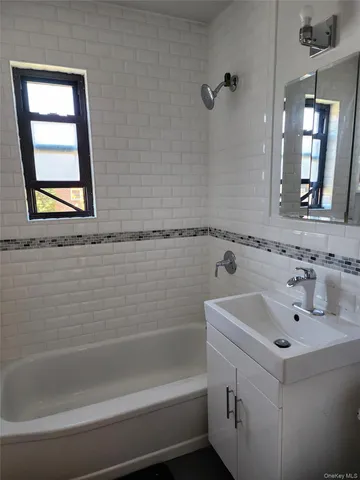 a bathroom with a sink and a bathtub