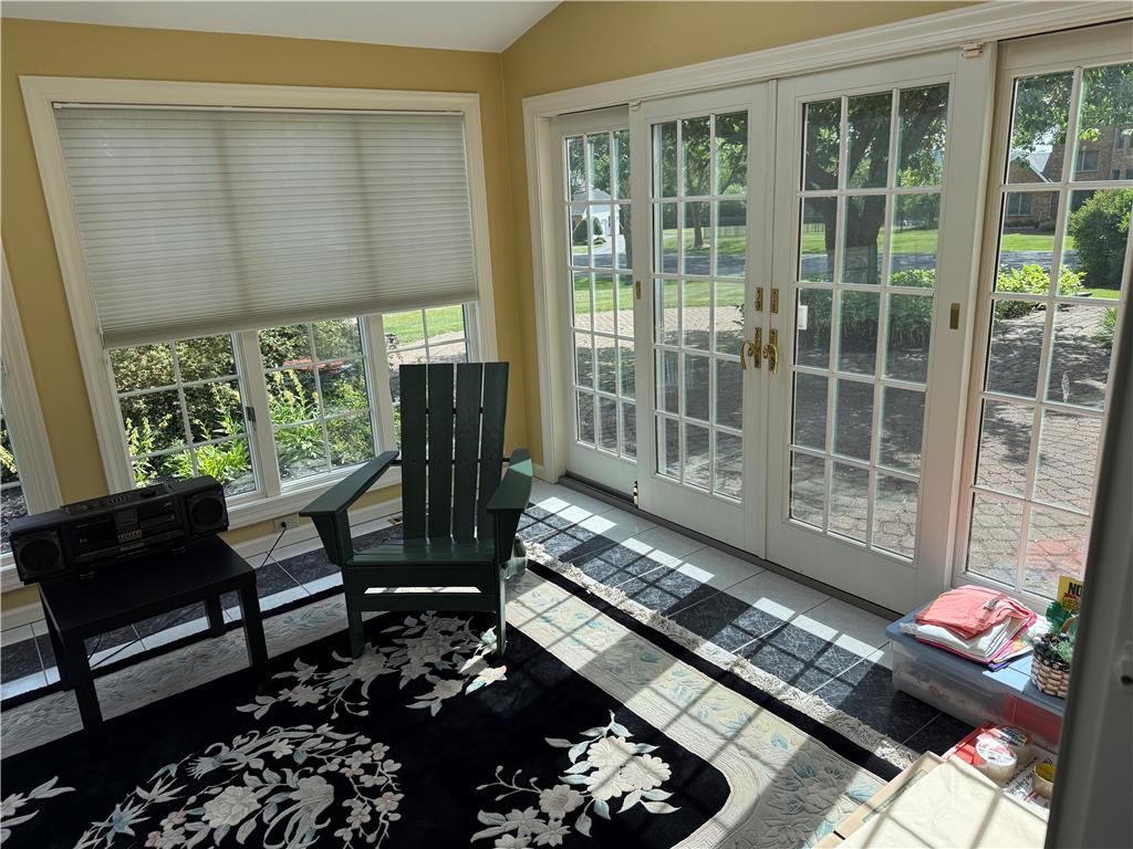 4114 Rochelle Drive Allentown, PA 18104 - Photo 14 of 35 Sun-filled room boasts abundant natural light, offering delightful views through the classic French doors.