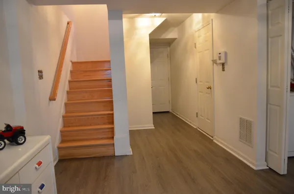 a view of entryway with wooden floor