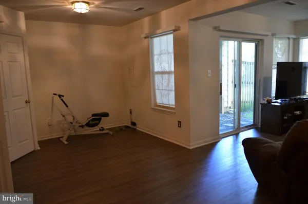 a view of a livingroom with furniture and a flat screen tv