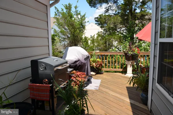 a view of balcony with patio outdoor seating and wooden floor