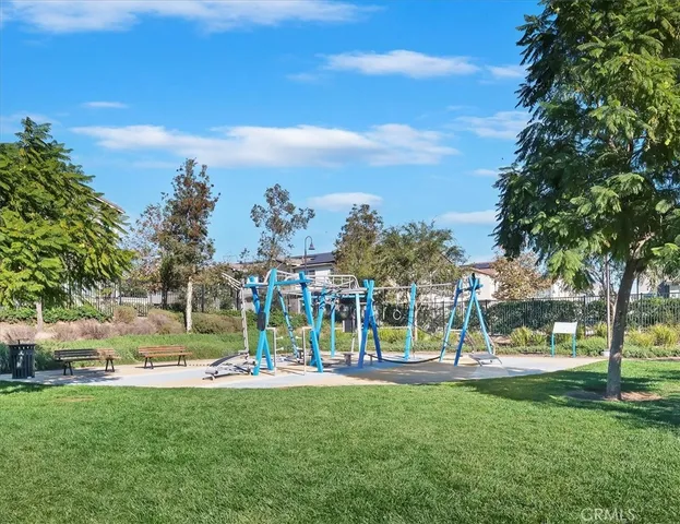 a view of a park with swings and slides