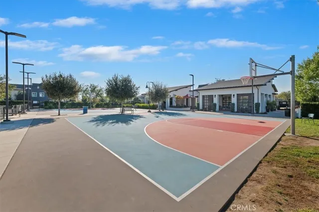 an outdoor space with lots of tables and chairs