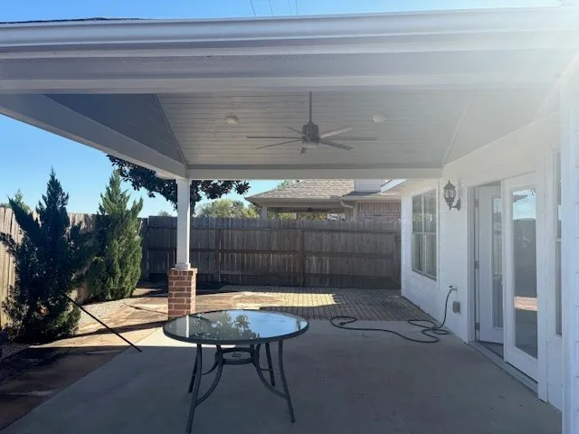 a view of a backyard with a tub