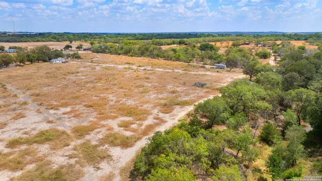 an aerial view of houses with yard