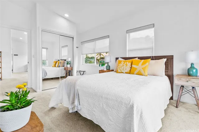 a bedroom with a bed and window