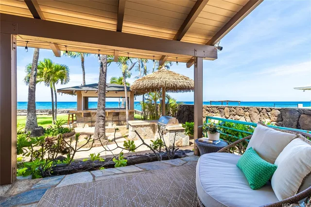 a view of a patio with a table and chairs