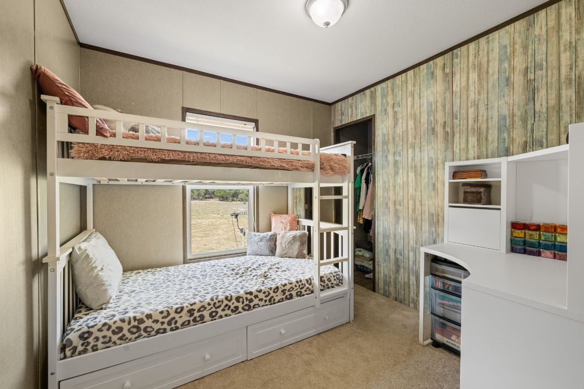 17787 Fm 963 Bertram, TX 78605 - Photo 13 of 40 a bedroom with a large bed and a large window