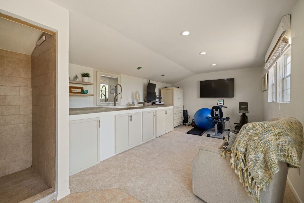 17787 Fm 963 Bertram, TX 78605 - Photo 22 of 40 a living room with furniture a flat screen tv and kitchen view