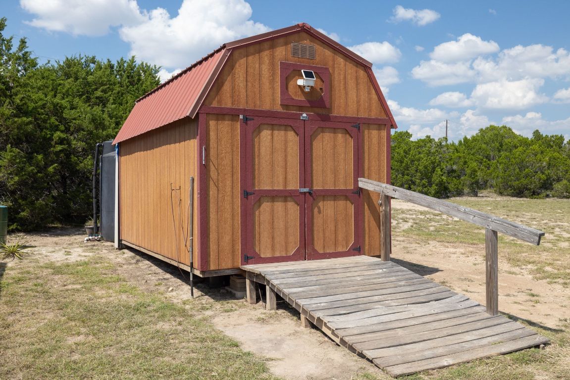 17787 Fm 963 Bertram, TX 78605 - Photo 24 of 40 a backyard of a house with wooden fence