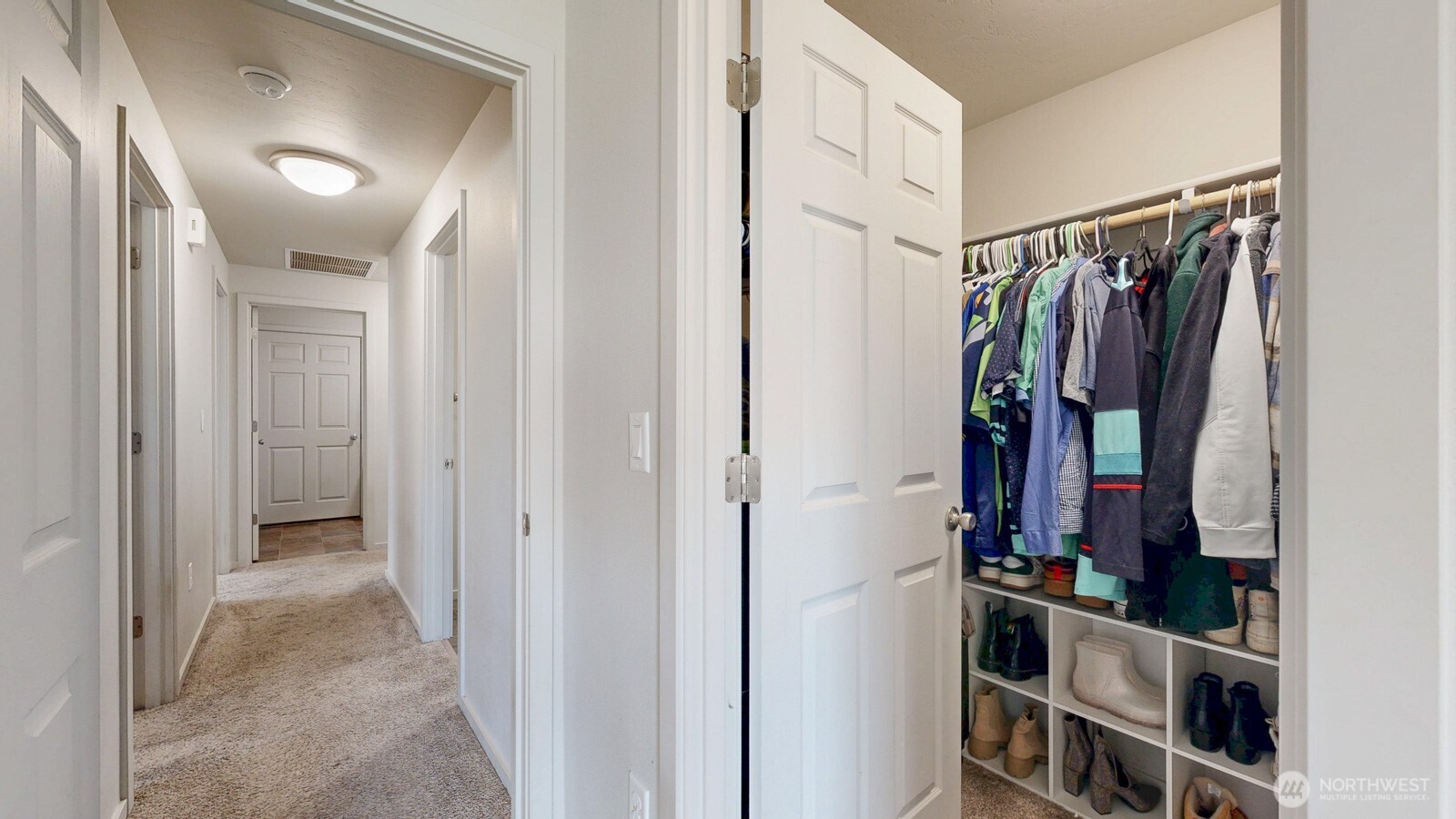 907 East Cascade Street Othello, WA 99344 - Photo 16 of 27 a view of walk in closet with clothes and shoes