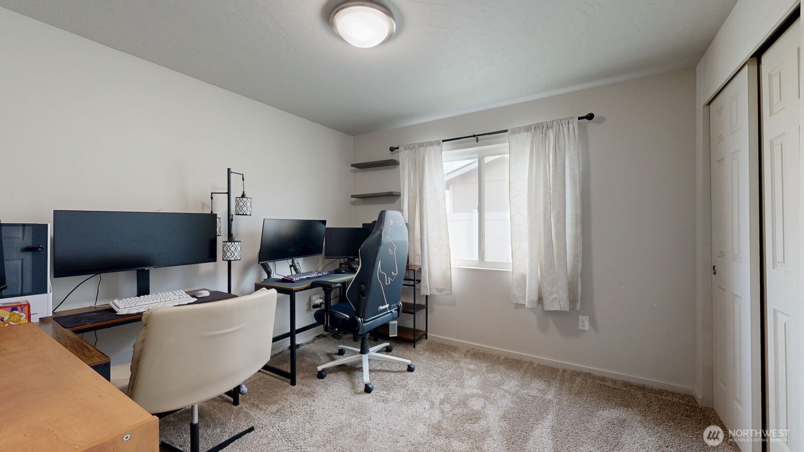 907 East Cascade Street Othello, WA 99344 - Photo 17 of 27 a view of a workspace with furniture and a window