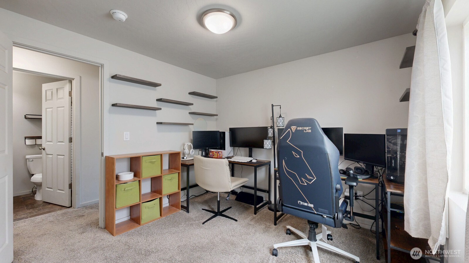 907 East Cascade Street Othello, WA 99344 - Photo 18 of 27 a view of a workspace with furniture and a window