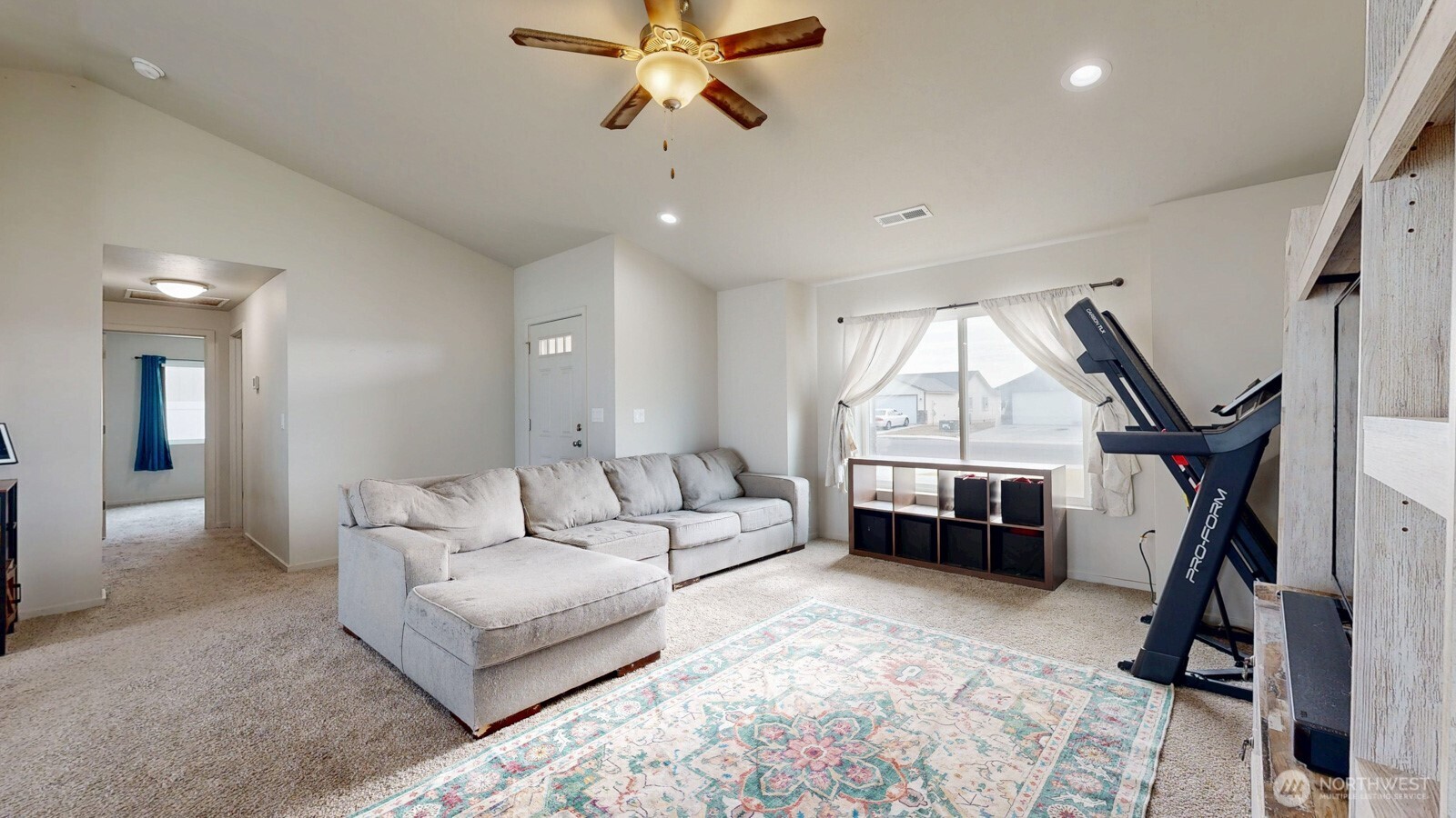 907 East Cascade Street Othello, WA 99344 - Photo 3 of 27 a living room with furniture a large window and a walk in closet