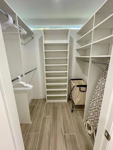 a bathroom with a sink a mirror and a shower