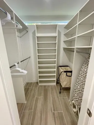 a bathroom with a sink a mirror and a shower