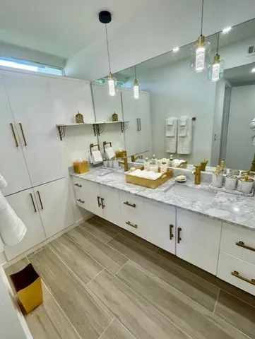 a bathroom with a shower a toilet and a sink
