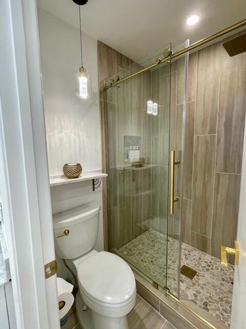 a view of a livingroom with furniture and a flat screen tv