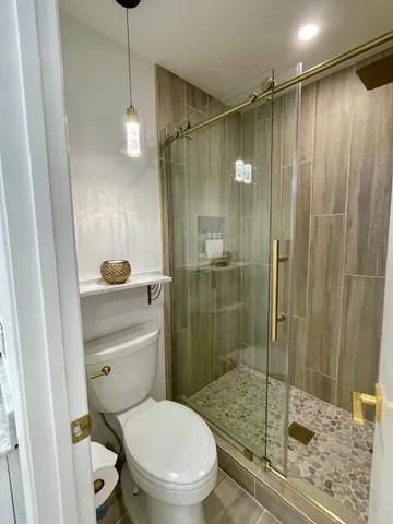 a view of a livingroom with furniture and a flat screen tv