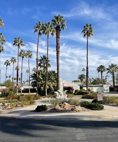 a vase of flowers sitting on a table with a vase of flowers