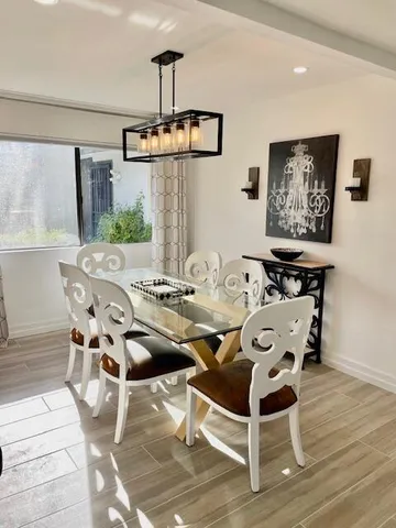 a view of a dining room with furniture window and outside view