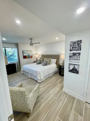 a bedroom with a bed and a couch